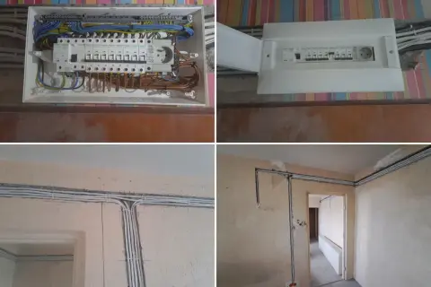 Nowy rozdzielacz i przewody elektryczne w bloku. Trwa wymiana instalacji elektrycznej, widać nowe zabezpieczenia i uporządkowane okablowanie.